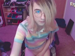slim teen femboy in glasses tugs her big dick on webcam