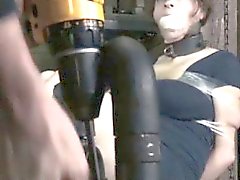 BDSM sub gagged and restrained with tape