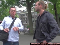 Dutch prostitute sucks tourist at red lights