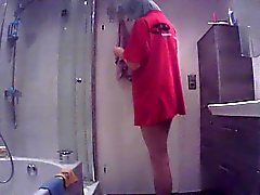 Hidden cam catches a babe getting out of the shower and dre