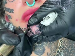 Australian bombshell Amber Luke gets a new chin tattoo